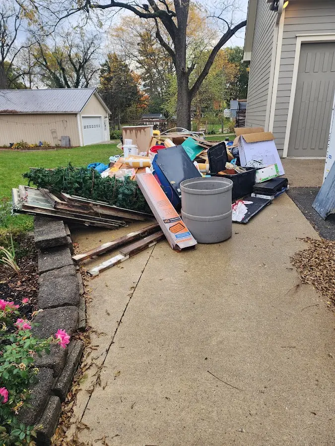 Dumpster being loaded with debris for Demolition Dumpster Rental in Connellsville